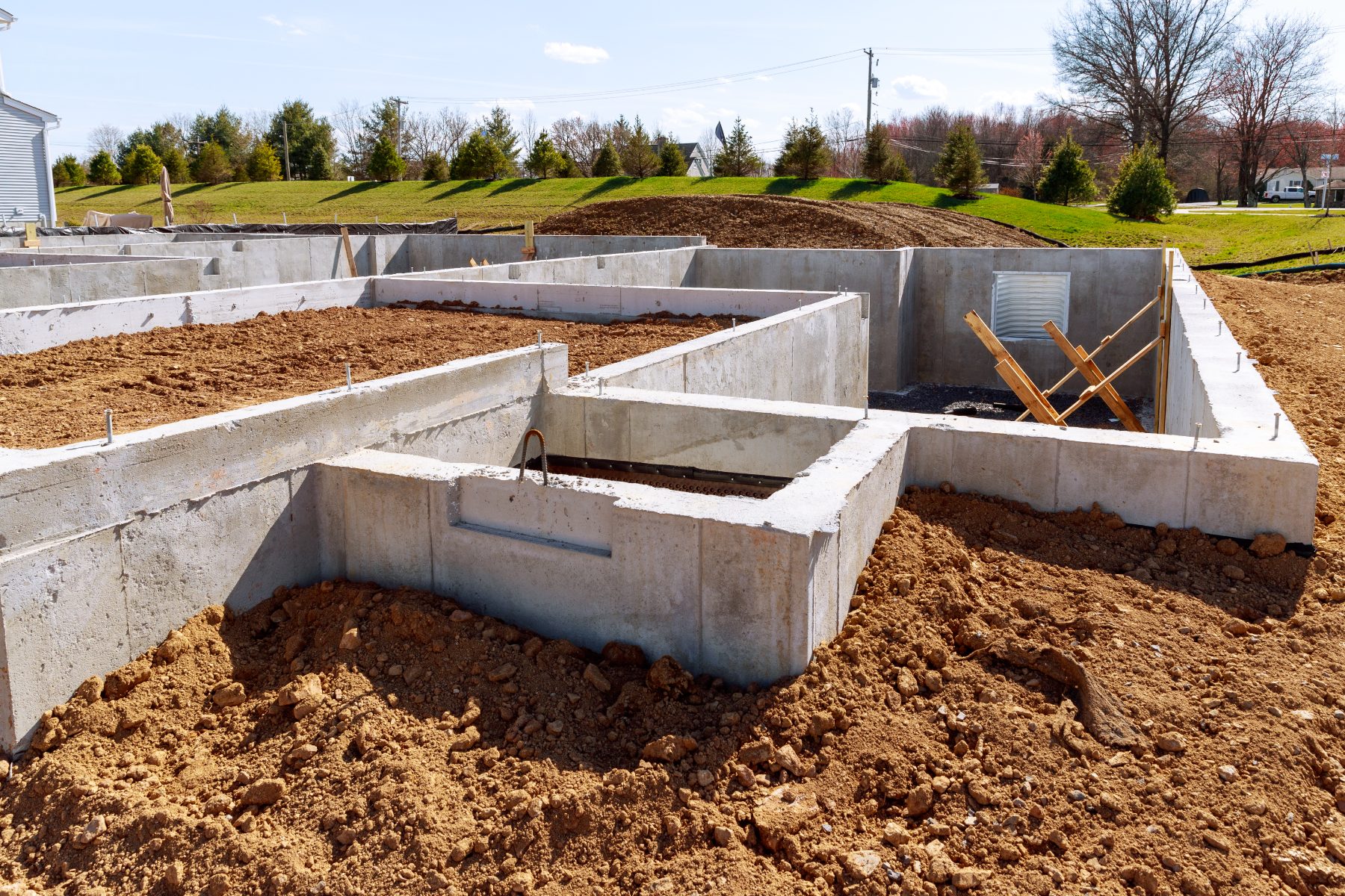 Concrete foundations and excavated ground on a groundworks site