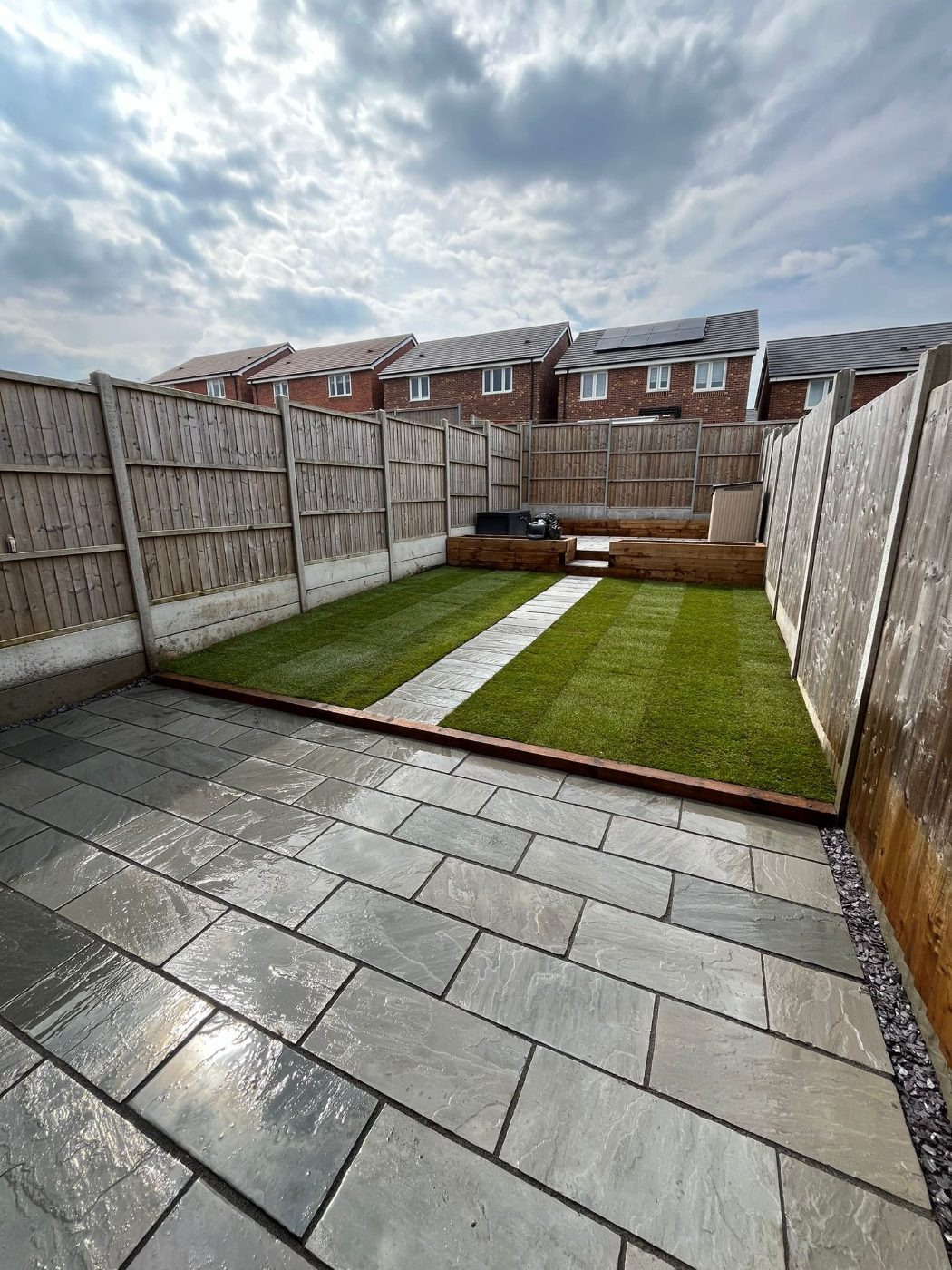 Indian sandstone patio and freshly laid lawn